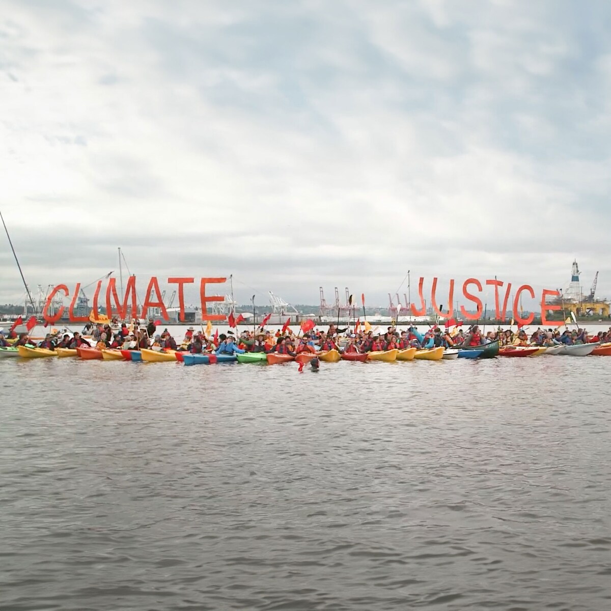 hundreds of Kayak-paddling activists —  “kayaktivists” 