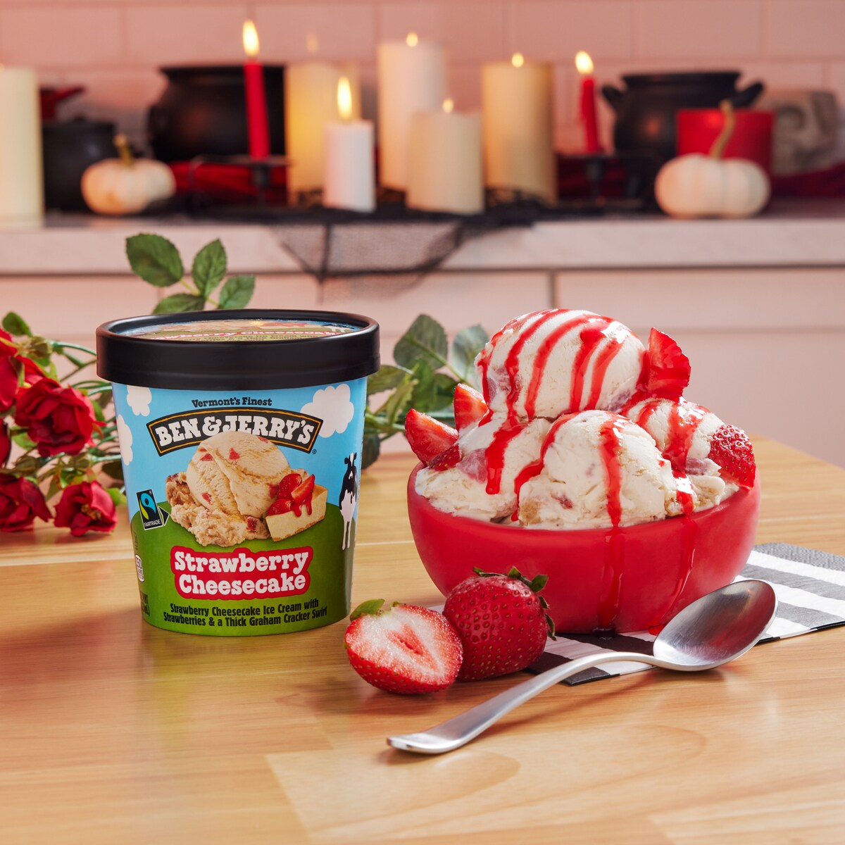 Pint of Ben & Jerry's Strawberry Cheesecake ice cream next to a sundae.