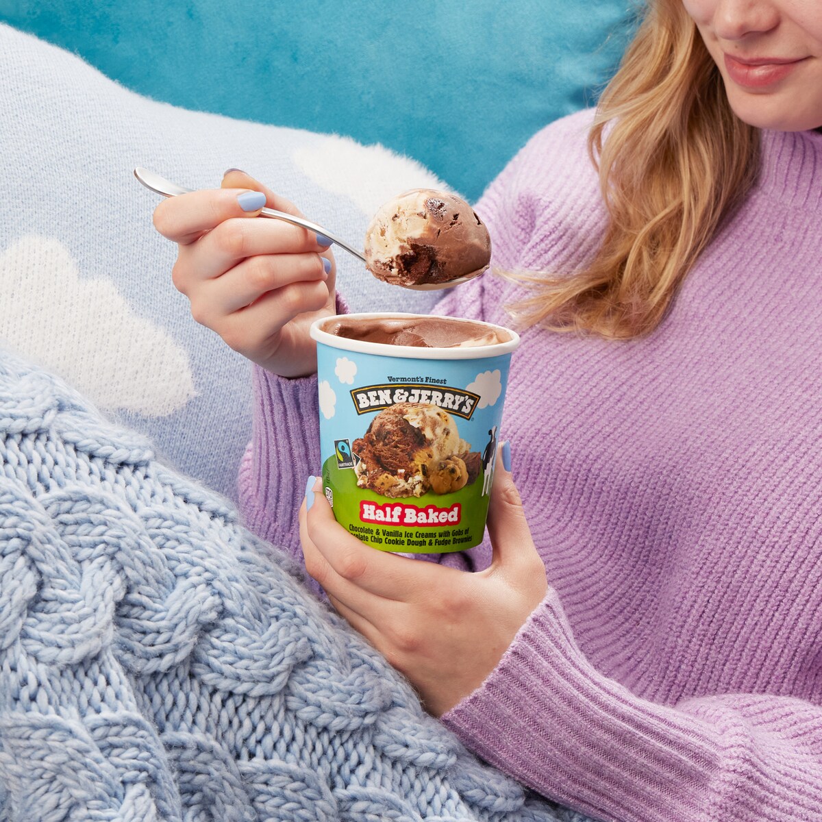Person holding a pint of Ben & Jerry's Half Baked ice cream