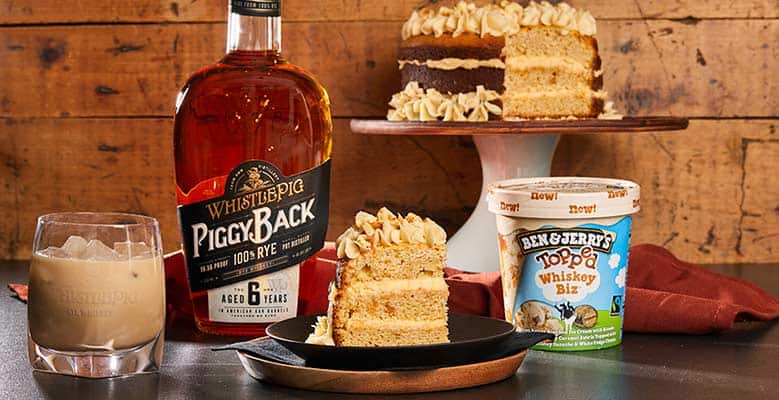 Photo of Ben & Jerry's Whiskey Biz Topped ice cream, WhistlePig PiggyBack Rye Whiskey, The Whiskey Biz cocktail, and the Whiskey Biz Ganache Topped Layer Cake.