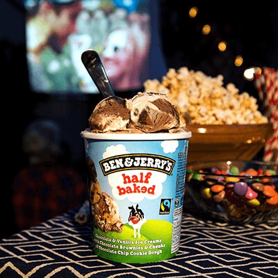 Pint of Half Baked, popcorn and a moving playing in the background