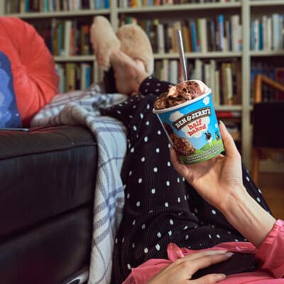 Eating a Pint of Half Baked while relaxing on couch