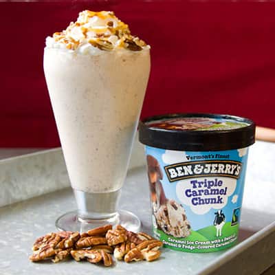 Ben & Jerry's Triple Caramel Chunk ice cream next to a Pecan Turtle Milkshake.