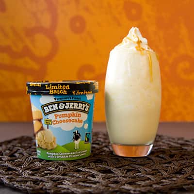 Ben & Jerry's Pumpkin Cheesecake ice cream next to a maple pumpkin pie milkshake.