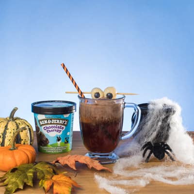 Mug of Witch's Brew Float with eyes on top. Pint of Ben & Jerry's Chocolate Therapy ice cream.